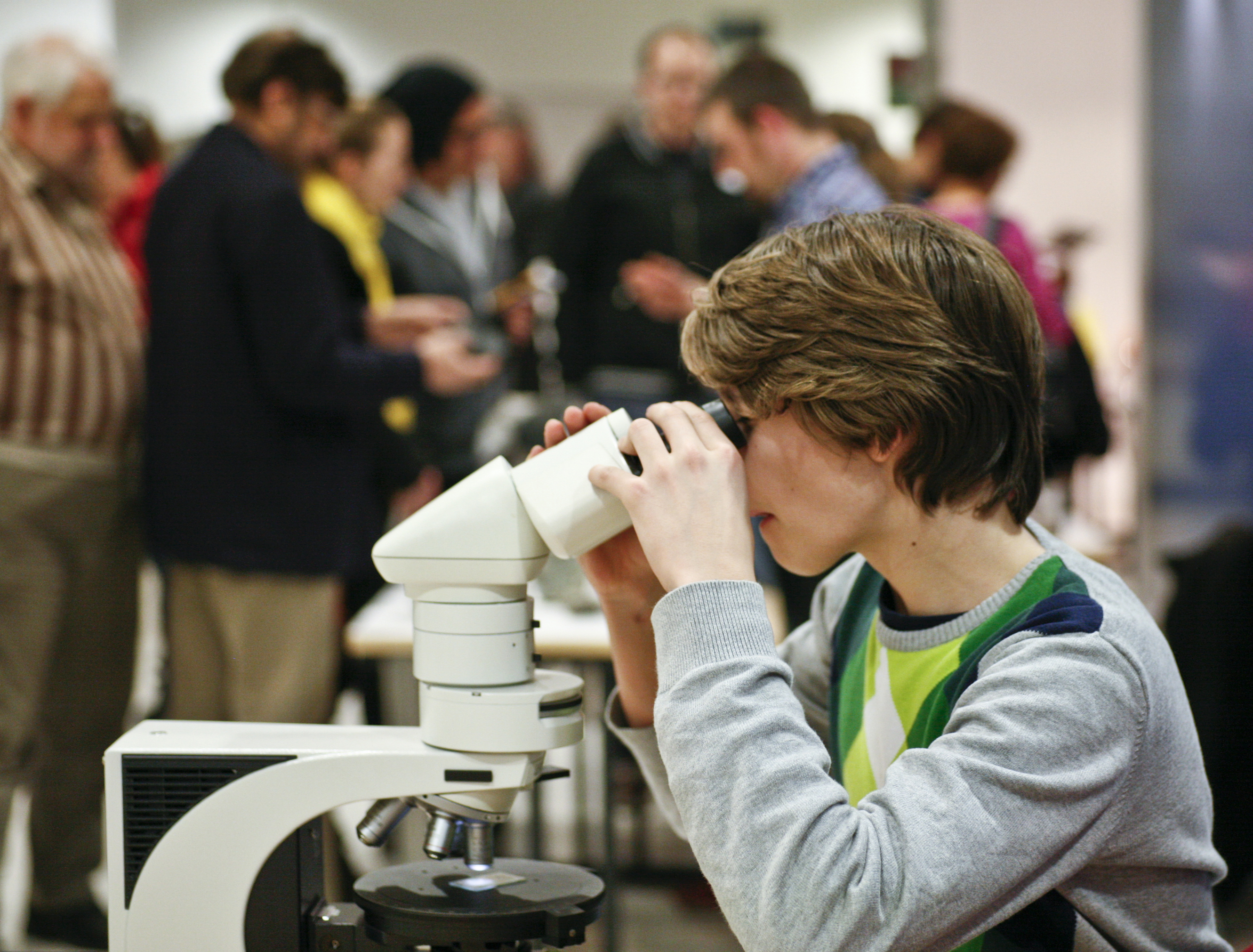 A child at a microscope